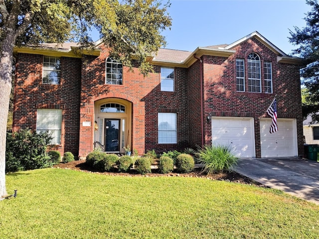 view of front facade with a garage and a front yard