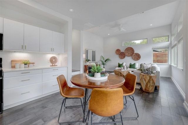 dining room with dark hardwood / wood-style floors and ceiling fan