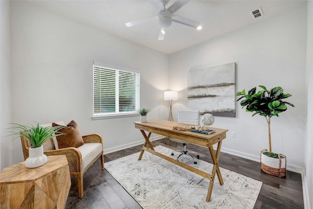 office space featuring dark hardwood / wood-style flooring and ceiling fan