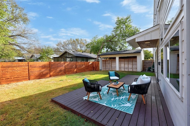 wooden deck featuring a lawn