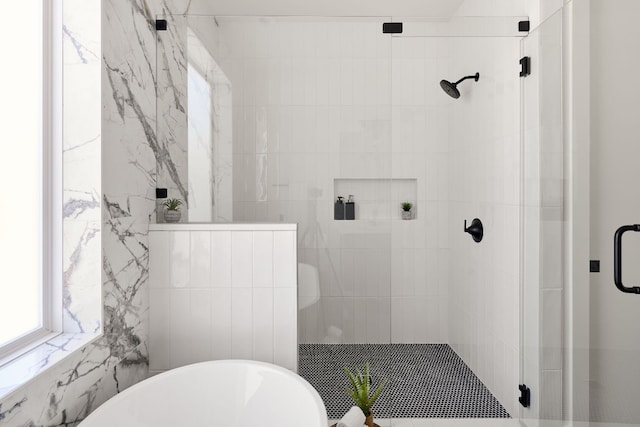 bathroom with separate shower and tub