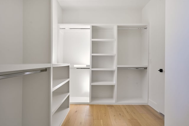 walk in closet featuring light hardwood / wood-style flooring