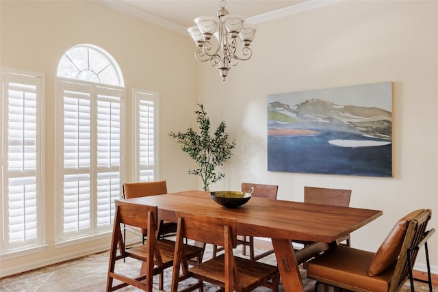 dining area featuring ornamental molding and a chandelier