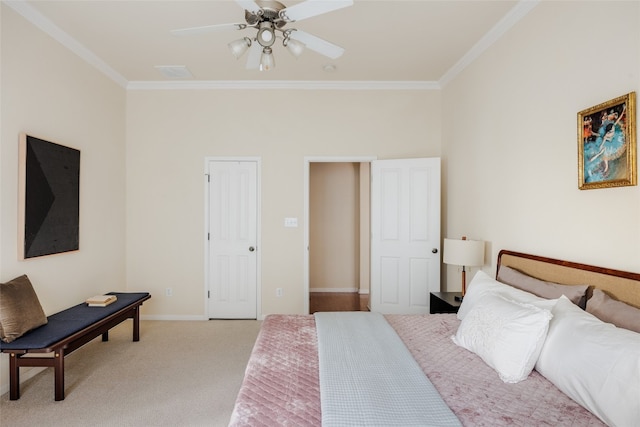 carpeted bedroom featuring ceiling fan and ornamental molding