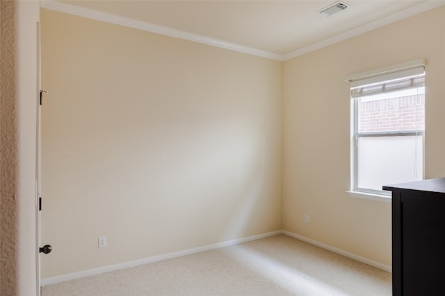 carpeted spare room with crown molding