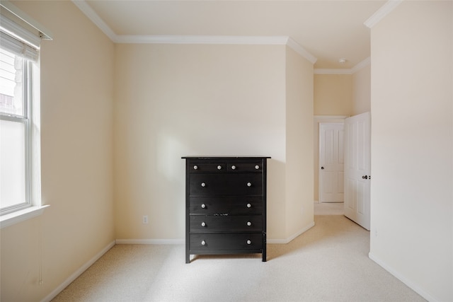 unfurnished bedroom featuring light colored carpet and ornamental molding