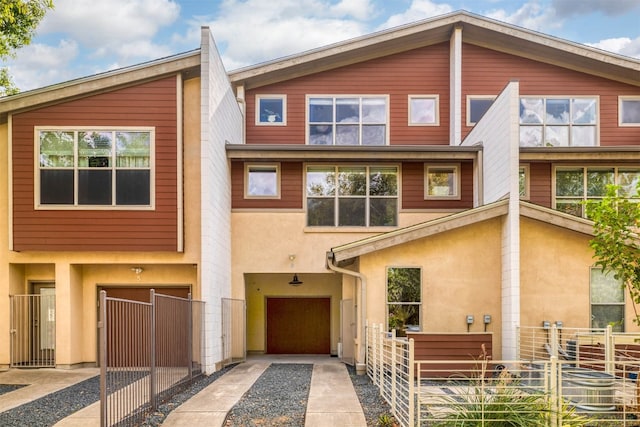 townhome / multi-family property featuring a garage