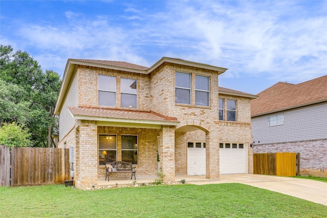 view of front of property with a front lawn and a garage