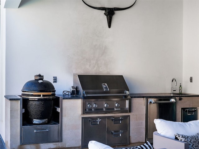 view of patio / terrace with an outdoor kitchen and a grill