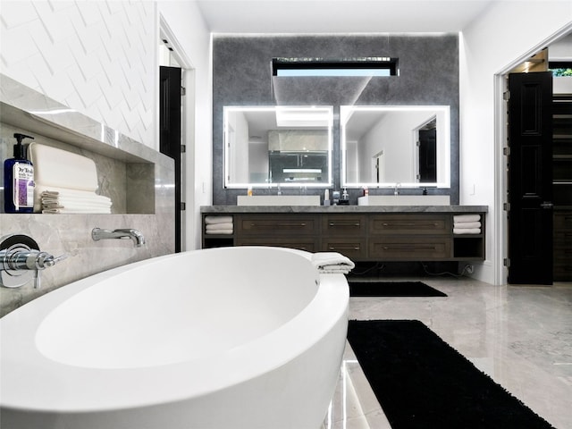 bathroom featuring a bathing tub and vanity