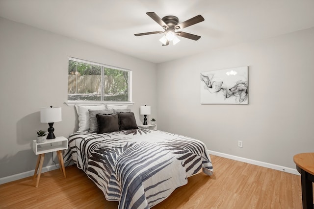 bedroom with light wood-type flooring and ceiling fan