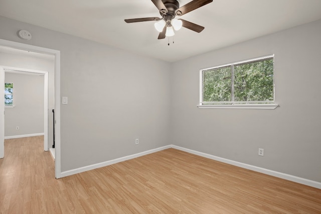 unfurnished room featuring ceiling fan and light hardwood / wood-style flooring