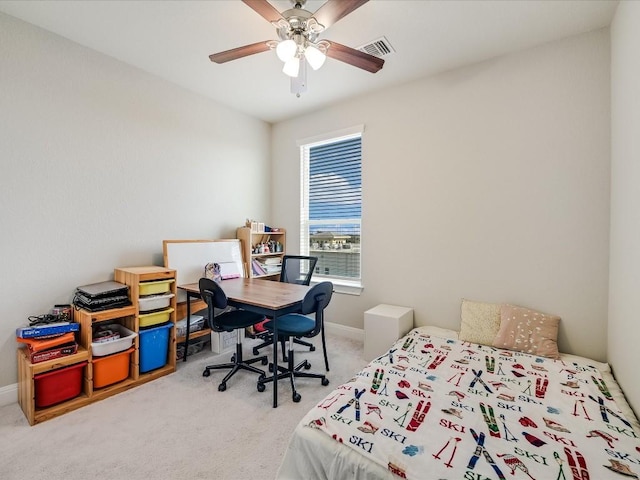 carpeted bedroom with baseboards, visible vents, and ceiling fan