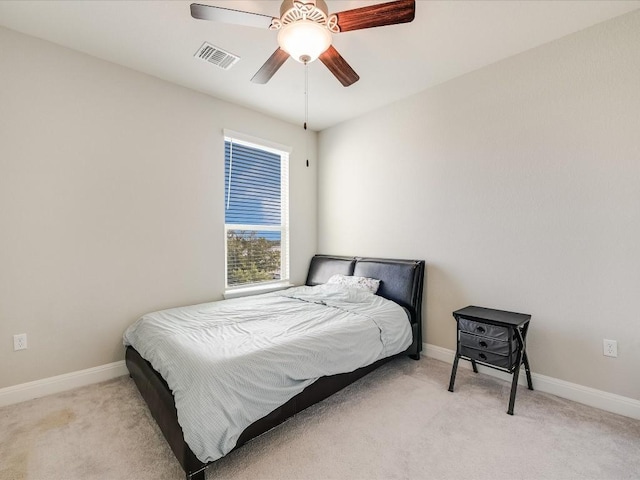 bedroom with baseboards, visible vents, ceiling fan, and carpet flooring