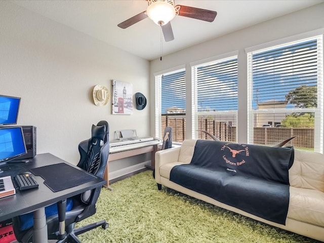 office area featuring ceiling fan and baseboards