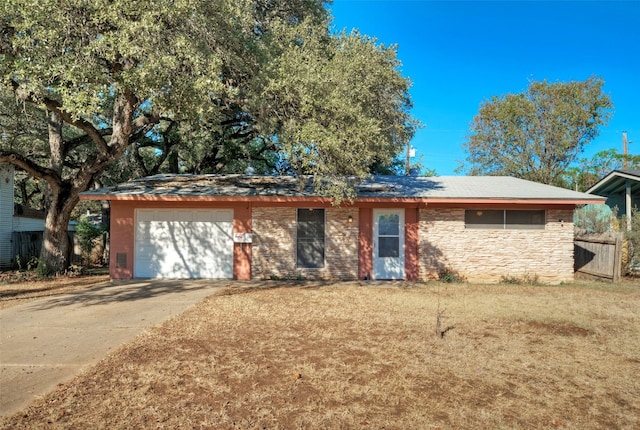 single story home featuring a garage