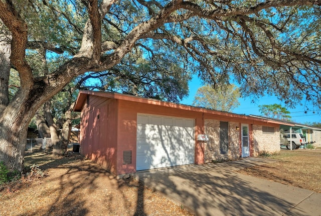 ranch-style house featuring a garage