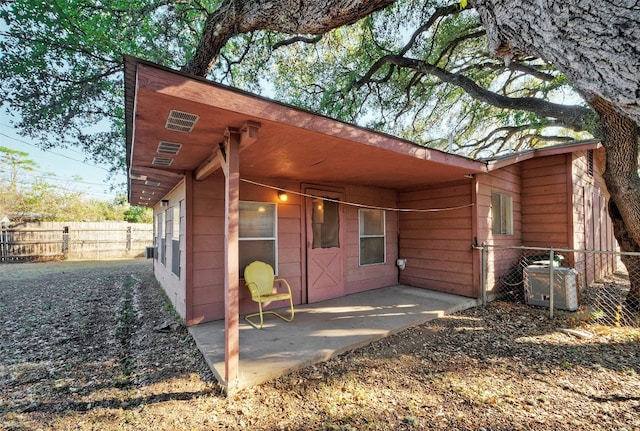 exterior space with a patio and cooling unit