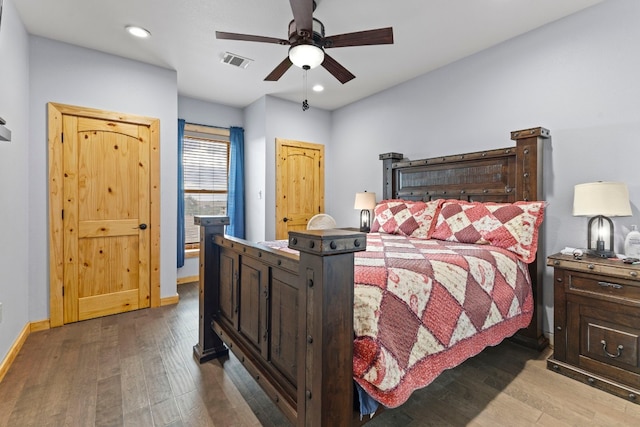 bedroom featuring hardwood / wood-style flooring and ceiling fan