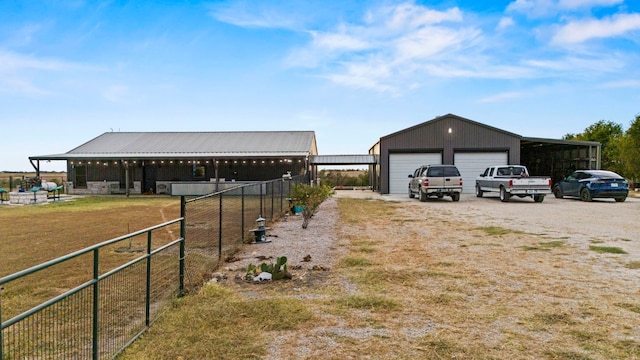 view of yard with a garage and an outdoor structure