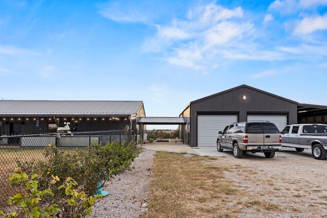 view of home's exterior featuring an outbuilding and a garage