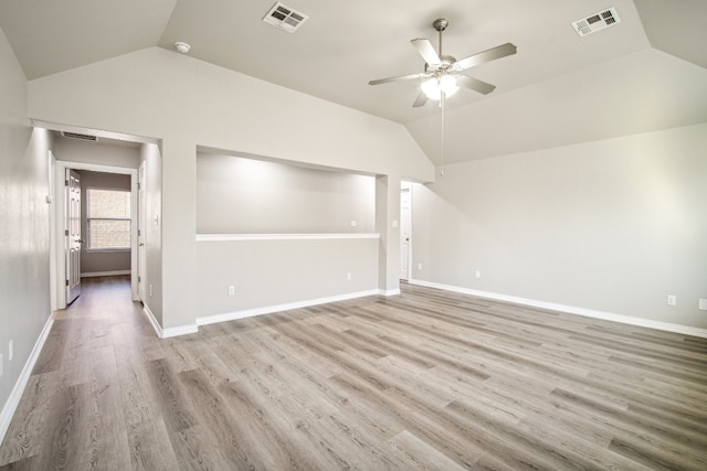 unfurnished living room with ceiling fan, light wood-type flooring, and vaulted ceiling