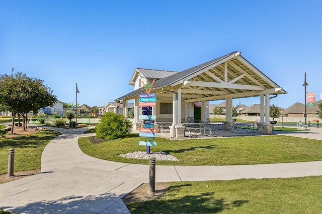 view of community featuring a lawn and a gazebo