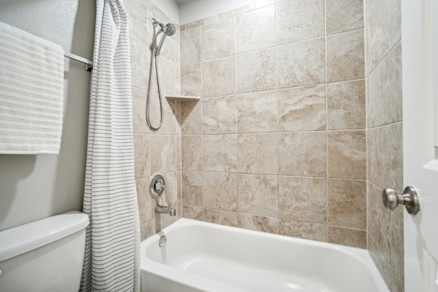 bathroom featuring toilet and shower / bath combo with shower curtain