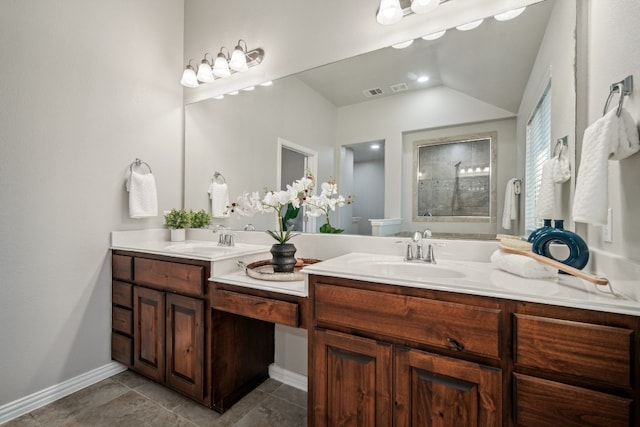 bathroom featuring walk in shower, lofted ceiling, tile patterned floors, and vanity