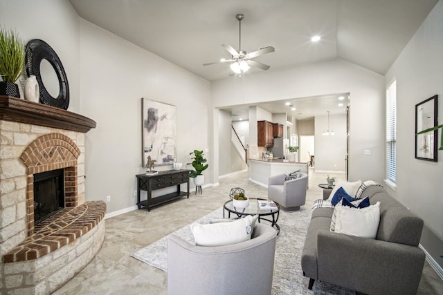 living room featuring ceiling fan and lofted ceiling