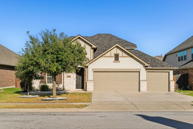 view of front of house featuring a garage and a front yard