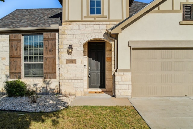 view of exterior entry featuring a garage