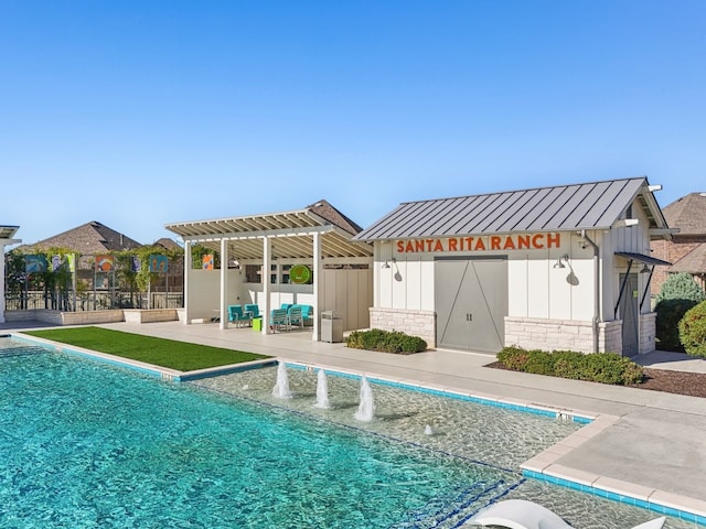 view of swimming pool featuring a patio area and pool water feature