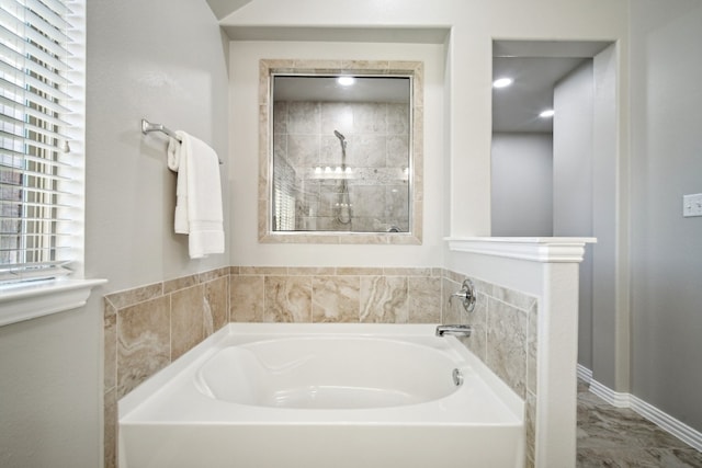 bathroom featuring a tub to relax in