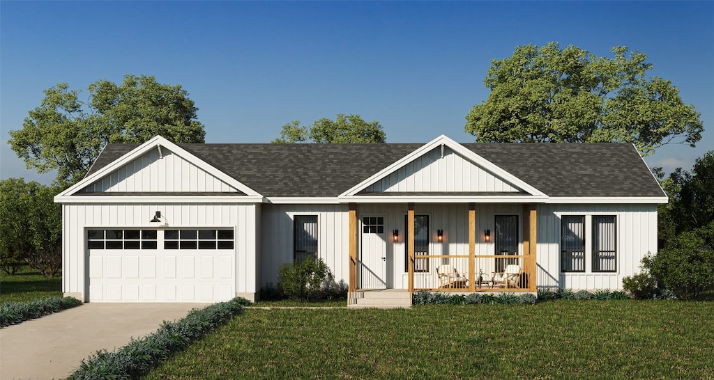 view of front facade featuring a front yard, covered porch, and a garage