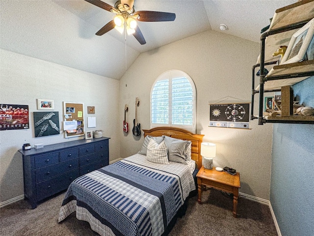 bedroom featuring vaulted ceiling, dark colored carpet, and ceiling fan