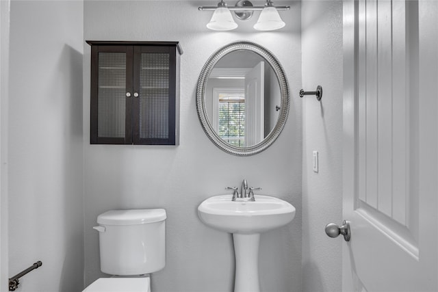 bathroom with toilet and sink