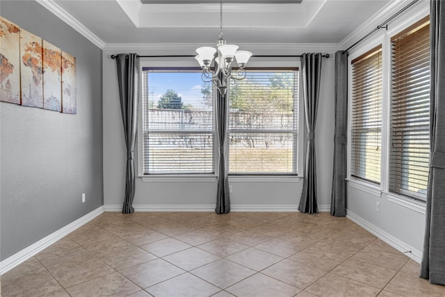 interior space featuring a tray ceiling, a notable chandelier, a healthy amount of sunlight, and crown molding