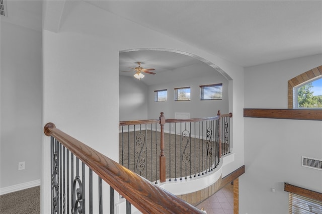 hall featuring light colored carpet