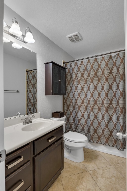 full bathroom featuring a textured ceiling, shower / bathtub combination with curtain, vanity, tile patterned floors, and toilet