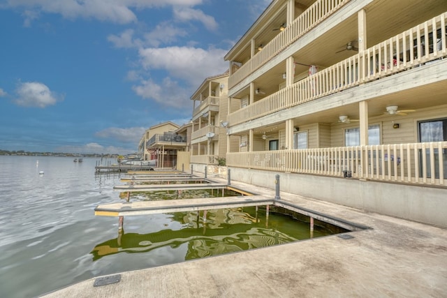 dock area featuring a water view and a balcony