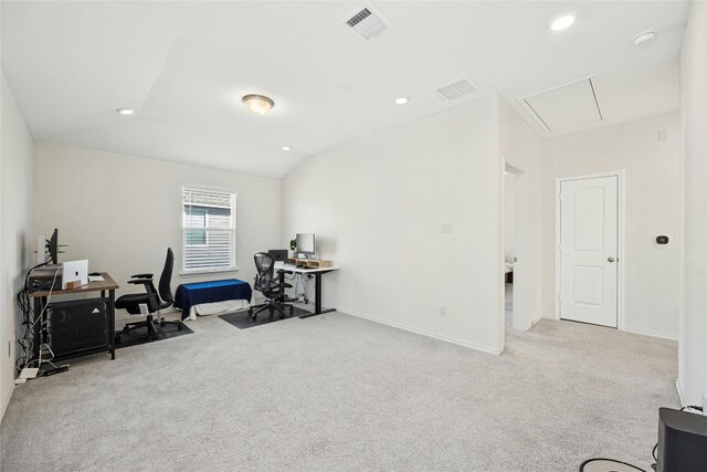 carpeted office featuring vaulted ceiling