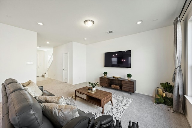 living room featuring light carpet