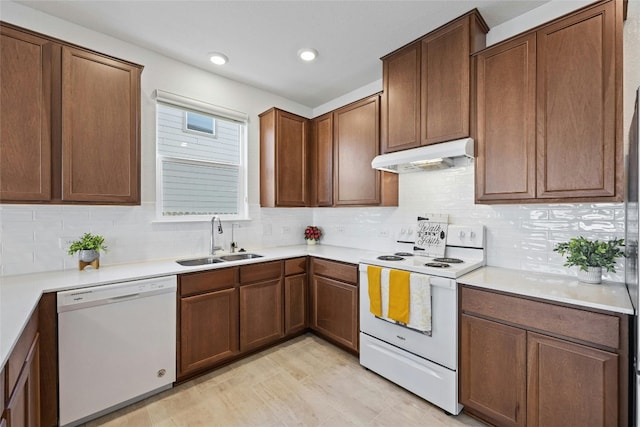 kitchen featuring range with electric stovetop, decorative backsplash, sink, and dishwasher