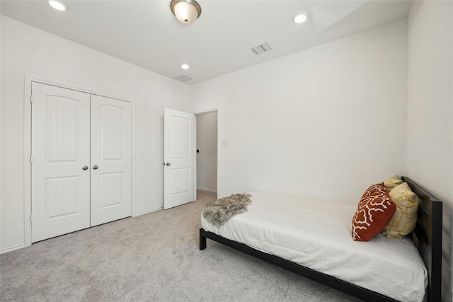 carpeted bedroom featuring a closet