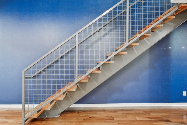 503 Swanee Dr Unit 19, Austin, TX 78752 - stairs featuring wood finished floors