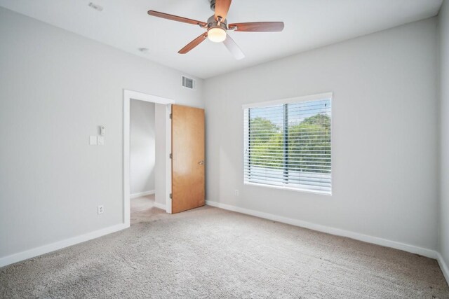 unfurnished bedroom with carpet and ceiling fan