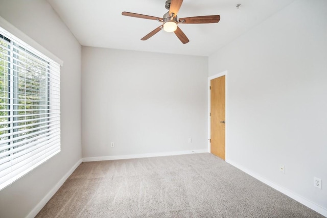 empty room with carpet flooring and ceiling fan