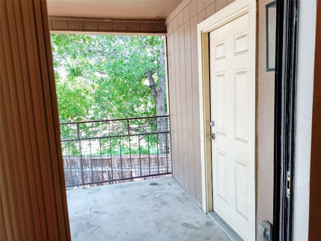 entrance to property featuring a balcony