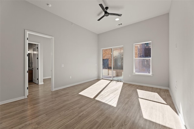 spare room featuring wood-type flooring and ceiling fan